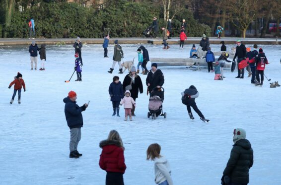 Children play and sit on the sculpture in the middle of the duck pond at Queen’s Park, Glasgow earlier this year