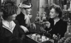 Phyllis Povah and Rosalind Russell pick a perfume, guided by store assistant Joan Crawford, right, in 1939 movie The Women