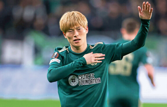 Kyogo Furuhashi demonstrates what Celtic mean to him after scoring in Budapest on Thursday.