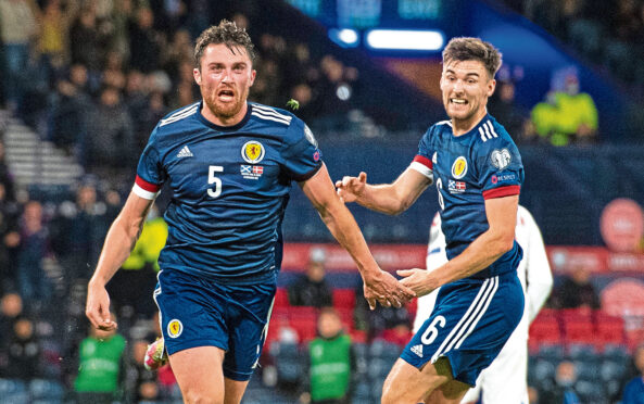 John Souttar and Kieran Tierney celebrate the Hearts man’s goal against Denmark.