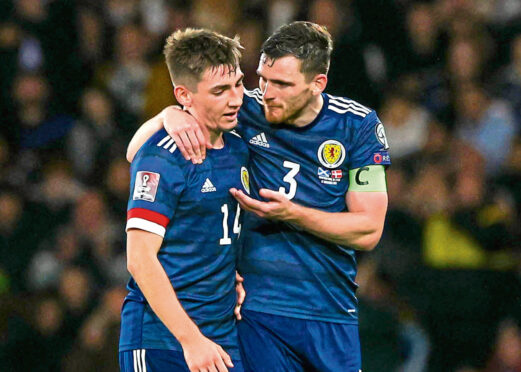 Billy Gilmour receives some words of wisdom from Scotland skipper Andy Robertson against the Danes