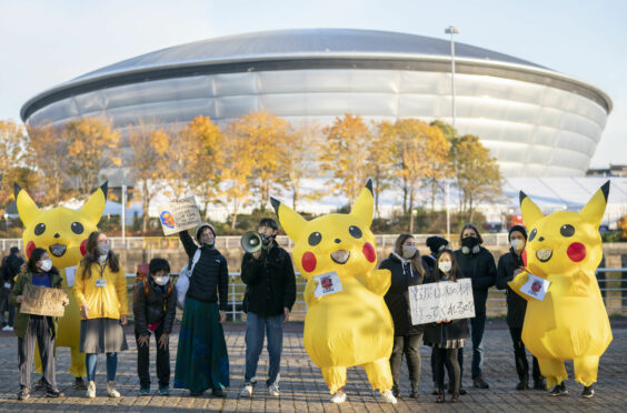 Life-sized 'Pikachu' characters joined activists from the No Coal Japan coalition, at Pacific Quay opposite the Glasgow COP26 campus