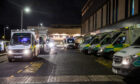 Ambulances wait outside A&E at the Queen Elizabeth University Hospital in Glasgow in November 2021 when we described how 15 were queuing to drop-off patients at 6pm on a Monday night