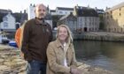 Gareth and Liz Thorpe in Portsoy, where they bought a cottage, and a property for a harbourside                                restaurant,
