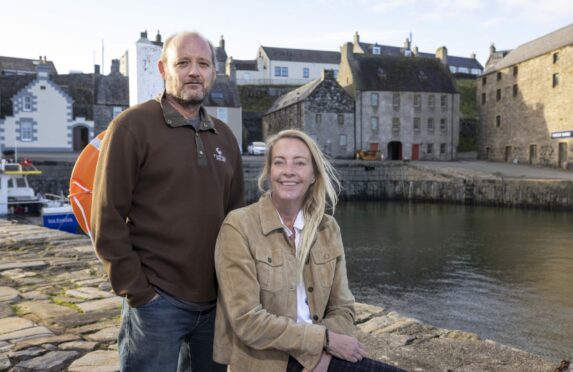 Gareth and Liz Thorpe in Portsoy, where they bought a cottage, and a property for a harbourside                                restaurant,