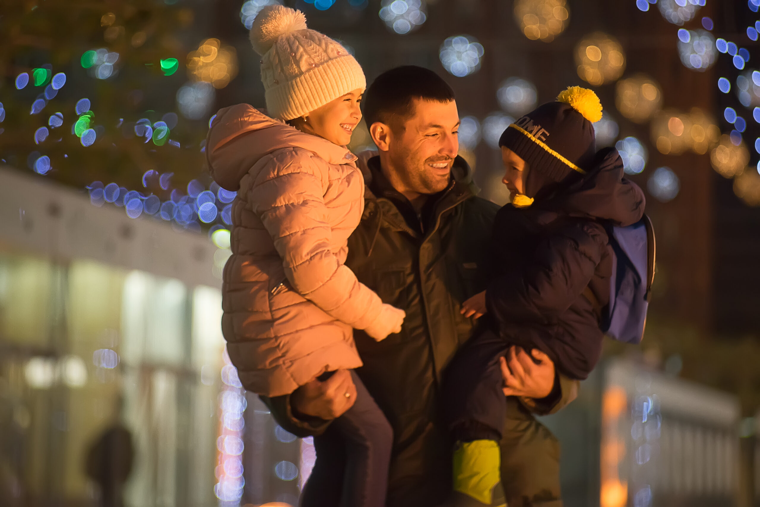 Man with two kids at Christmas