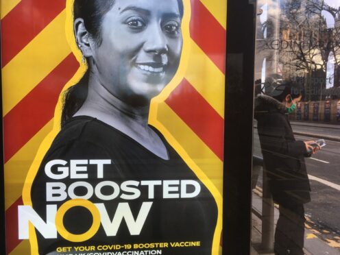 An advertising billboard in Edinburgh urges people to get their Covid booster