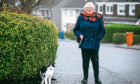 Maggie Clayton takes her cat Nico out for walks on a lead.