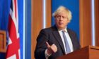 PM Boris Johnson announces new Covid restrictions at a press conference on Wednesday but scandal over No 10’s Christmas parties last year refuses 
to go away