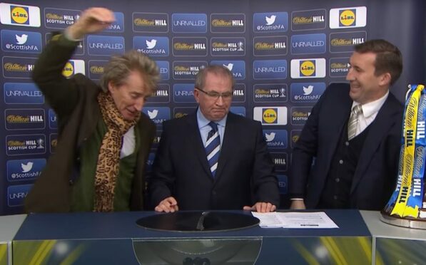 Sir Rod Stewart pulls out Rangers Ball during the William Hill Scottish Cup 5th Round Cup Draw