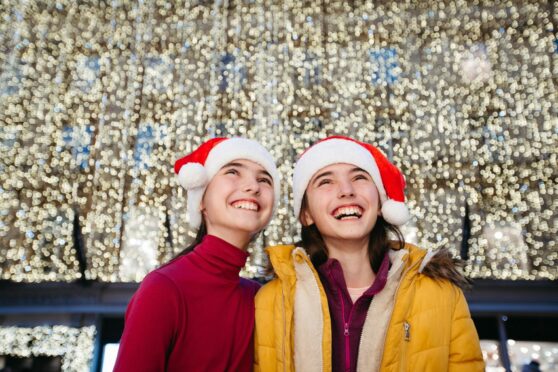 Twin sisters Amelia and Sophia Roose, 11, enjoying a day out shopping in Buchanan Street, Glasgow, yesterday