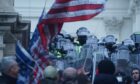 Police confront supporters of Donald Trump during the US Capitol riots in Washington DC on January 6 last year