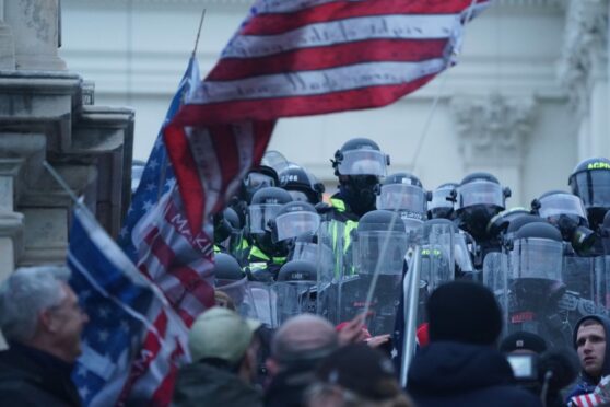 Police confront supporters of Donald Trump during the US Capitol riots in Washington DC on January 6 last year