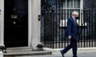 Boris Johnson walks out of No 10 on Wednesday to face MPs in the Commons