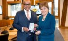 Nicola Sturgeon presents Sanjeev Gupta with a special medal in 2018 to mark two years since the GFG deal