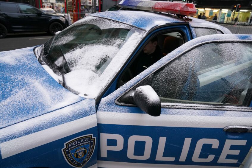 A city of Gotham police car covered in snow (Pic: Andrew Milligan/PA Wire)