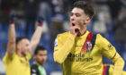 Bologna's Aaron Hickey celebrates scoring against Sassuolo