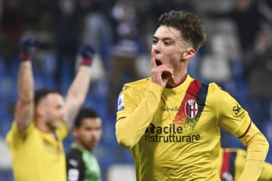 Bologna's Aaron Hickey celebrates scoring against Sassuolo