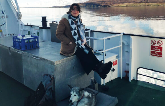 Cal Flyn and her dog take the ferry to Orkney, with the hills of Hoy in the background