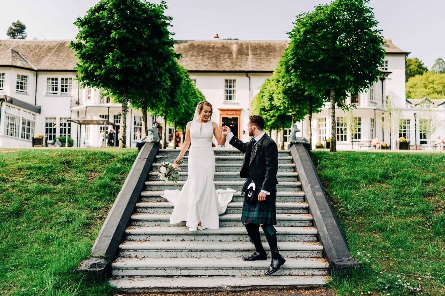 bride and groom celebrating wedding at Dunkeld House Hotel