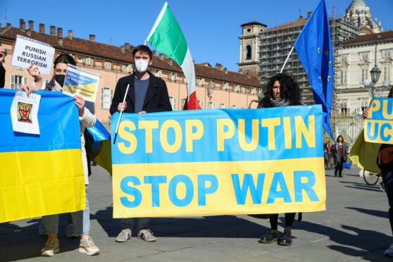 Pro-Ukrainian demonstrators gather in Piazza Castello to protest the Russian invasion in Turin, Italy.