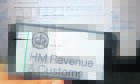 HM Revenue and Customs logo displayed on mobile phone.