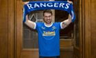Aaron Ramsey – seen at his unveiling last Monday – will be hoping to have cause to celebrate at Ibrox