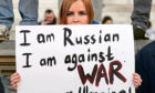People take part in a demonstration on Whitehall, at the entrance to Downing Street, London, to denounce the Russian invasion of Ukraine.