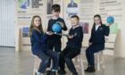 Dundard Primary School P5 pupils Isla Szczerkowska, Huxley Quirk, Tyler Dalgleish and Madison Waddell photographed at the Glasgow Science Centre with environmental exhibits and furniture donated by Ikea from Cop26