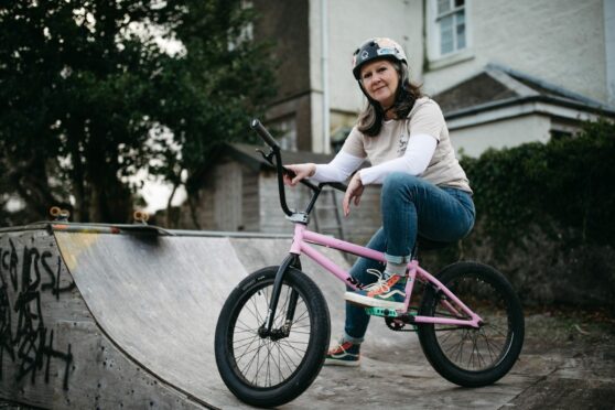 Mum Jackie Hood now loves to BMX and do extreme sports with her sons after surviving breast cancer.