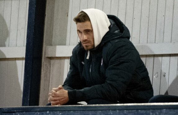 David Goodwillie watches Raith's game against Queen of the South on Tuesday