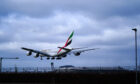 An Emirates A380 lands safely at Heathrow Airport