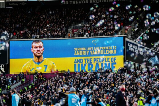 West Ham fans show support for their Ukrainian winger Andriy Yarmolenko and his country at the London Stadium on Sunday