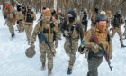 Ukrainian servicemen training in the snow outside Kharkiv in northeast Ukraine on Friday