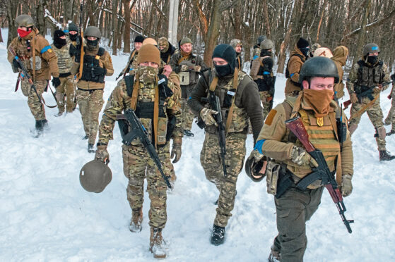 Ukrainian servicemen training in the snow outside Kharkiv in northeast Ukraine on Friday