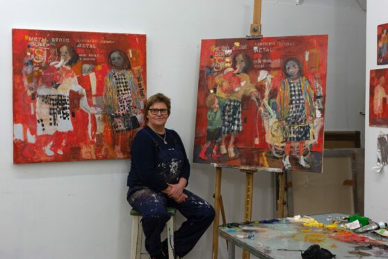 Kate Downie in her studio with the original Eardley Two Children painting to her left and her new version on the right