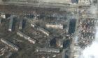 Damaged and burned apartment buildings in Mariupol, Ukraine (Pic: Maxar Technologies via AP)