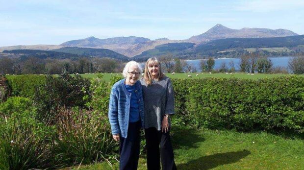 Maggie McEachern in her garden on Arran with mother Ann. Ann has missed vital cancer medication being delivered on time due to ferry disruption.