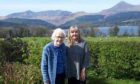 Maggie McEachern in her garden on Arran with mother Ann. Ann has missed vital cancer medication being delivered on time due to ferry disruption.