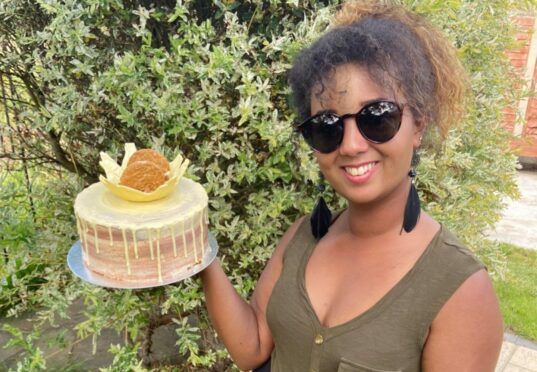 Sally El-Arifi, author of The Little Book Of Bananas, shows off a chocolate chip cake