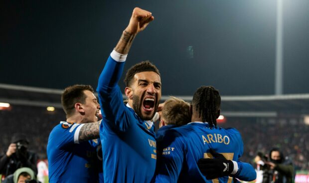 Connor Goldson celebrates after Ryan Kent's goal in Serbia