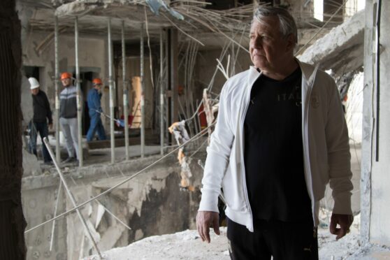 Aleksandr Paradovskiy surveys the damage after Russian missiles hit the residential block where he and his family lived in Odesa