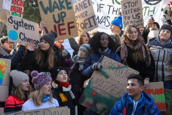 Vanessa Nakate, centre, pictured with other young activists, including Greta Thunberg on her right, during a climate protest in Switzerland