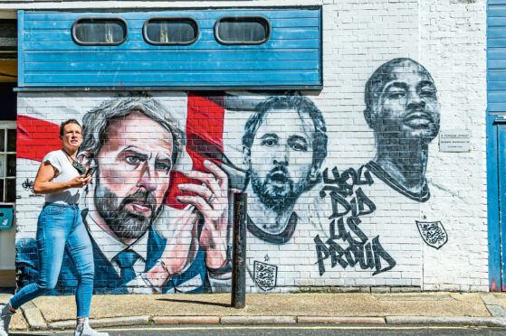England manager Gareth Southgate, hailed for kindling a different kind of patriotism, and stars Harry Kane and Raheem Sterling on a mural in London after Euros last year

Pic: Guy Bell
