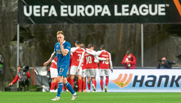 Braga celebrate their goal last Thursday night as Rangers’ Scott Arfield suffers.