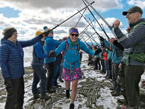 Friends’ guard of honour for Fiona 
on Beinn na Lap, her 282nd Munro.