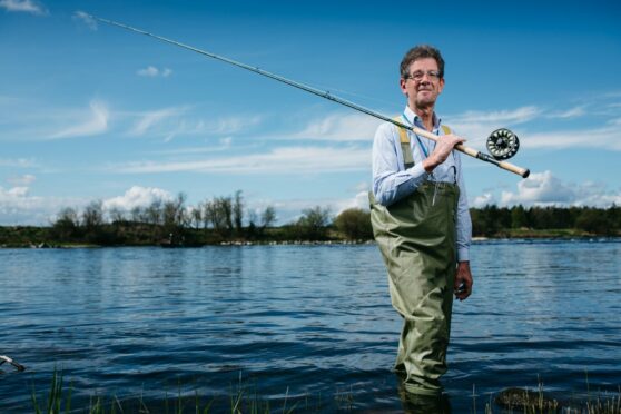 Andrew Douglas-Home wades into the River Tweed at Coldstream