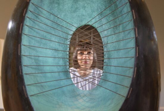 Leila Riszko admires Spring sculpture by Barbara Hepworth at National Gallery of Modern Art