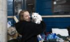 Anastasia Martynskaya cuddled her cat Lala on the floor of Kharkivs Studentska metro station