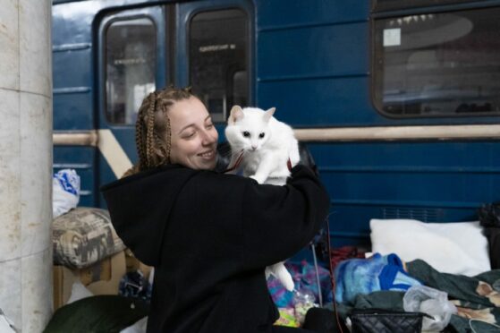 Anastasia Martynskaya cuddled her cat Lala on the floor of Kharkivs Studentska metro station